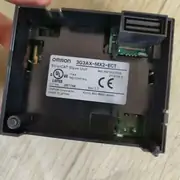 Omron 3G3AX-MX2-ECT — side view showing the slim card profile and the cover-release notch on the front edge of the host drive