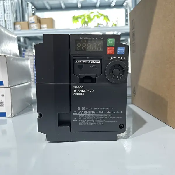 Omron 3G3MX2-A4007-V2 — front view of the MX2 inverter showing the operator panel with the run / stop keys, the frequency display, and the parameter scroll wheel on the dark grey housing