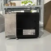 Omron 3G3MX2-A4007-V2 — side view showing the option slot cover for the EtherCAT / CompoNet / DeviceNet card, the EMC filter marking, and the cooling fan on the side of the housing