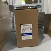 Omron 3G3MX2-A4007-V2 mounted in a panel next to a 3G3AX-MX2-ECT EtherCAT option card, with the 3-phase supply wired to the input side and the motor leads on the output side