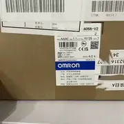 Omron 3G3MX2-A4055-V2 MX2 VFD - side view showing the integrated forced-air cooling fan on the top, the side-mounted screw terminals for 3-phase input (R/L1, S/L2, T/L3) and motor output (U/T1, V/T2, W/T3), and the option-card slot cover on the bottom