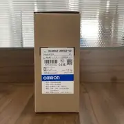 Omron 3G3MX2-AB002-V2 — front face of the compact inverter showing the detachable LED keypad, the rotary speed potentiometer, the RUN/STOP keys, and the V2 option slot cover on the left edge