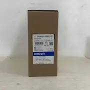 Omron 3G3MX2-AB002-V2 — side profile showing the 128 mm body height with the heat-sink fins on the rear and the top / bottom ventilation openings for natural convection cooling