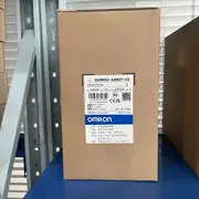 Omron 3G3MX2-AB007-V2 inverter drive — top label close-up showing the model number 3G3MX2-AB007-V2, the 0.75 kW / 200 V / single-phase rating, and the V2 firmware revision designation