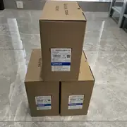 Three 3G3MX2-AB015-V2 boxes stacked one on top of two, with the front-face label showing TYPE 3G3MX2-AB015-V2 INVERTER, MASS 2.3 kg, Rev. AAAB Ver 1.0, and the barcode