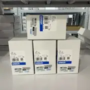 Omron 61F-G3 AC100-220V — three boxed units stacked, ready for shipment