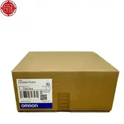 Omron C200HW-PA204S — third angle of the brown Omron-branded carton showing the same C200HW-PA204 type label, lot number 2843YK, and the Omron logo on a white background with a red company stamp at the top-left