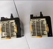 Omron CJ1W-CPU22 — side view showing the bus connector strip on the left that links to the CJ1W power supply and the connector on the right that links to the next CJ1W module