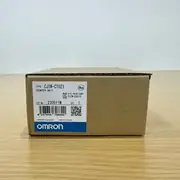 Omron CJ1W-CT021 — brown Omron product box with the CJ1W-CT021 / COUNTER UNIT type label, lot 230511M, OMRON Corporation mark, and a KC certification stamp