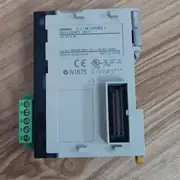 Omron CJ1W-DRM21 DeviceNet master/slave unit — front view showing the 5-pin DeviceNet connector (Phoenix-style screw terminals: V+, CAN_H, CAN_L, SHIELD, V-), the two rotary address switches (00-63), and the MS/NS/7-segment status indicators