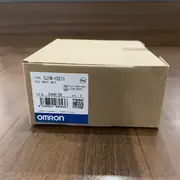 Omron CJ1W-ID211 16-point DC input module — side view showing the slim 31 × 90 × 65 mm form factor with the backplane connector on the left side and the DIN-rail release tab on the rear