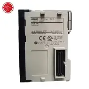Omron CJ1W-ID231 mounted with a G79-O@@@ pre-wired cable assembly connected to a remote terminal block — the Fujitsu connector on the unit's front face mates with the cable's FCN-361J040-AU connector, demonstrating the high-density bulkhead wiring