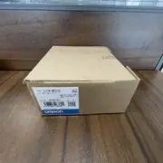 Omron CJ1W-MD232 shipping carton viewed from the side, with the same type label and lot number