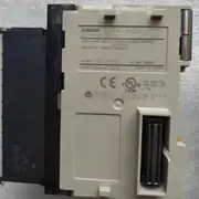 Omron CJ1W-OC201 8-point relay output unit — side view showing the CJ bus connector strip on the left for mounting on the CJ-series backplane, and the unit-width 31 mm slim form factor