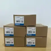 Omron CJ1W-OC211 16-point relay output unit — front view showing the 31 mm wide body with the removable M3 screw terminal block on the bottom edge and the 16 yellow output status LEDs across the front face