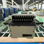 Omron CJ1W-OC211 16-point relay output unit — top label close-up showing the model number CJ1W-OC211, the 16-point 2 A 250 VAC rating, and the NY-24W-K-IE non-replaceable relay note