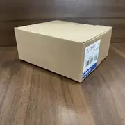 Omron CJ1W-OD232 shipping carton viewed from another angle, showing the same type label and lot number