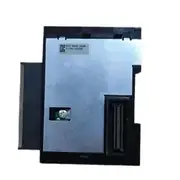 Bottom face of the Omron CJ1W-PA205R with the metallic backplate, KC-REM-OMR regulatory label, green ground screw, and brown backplane connector visible