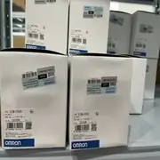 Omron CJ2M-CPU33 PLC CPU module — front face showing the 62 mm wide body with LED status indicators (RUN/ERR/COMM), USB Type-B programming port, option-board slot cover, and EtherNet/IP RJ-45 port on the front face