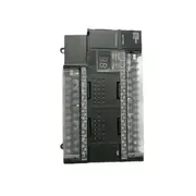 Omron CP1H-X40DR-A — installed alongside CP1W expansion units on a DIN rail in a control cabinet, with the front terminal cover removed for wiring