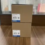 Omron CP1L-EM40DT1-D compact PLC — top label close-up showing model code and 24 VDC power rating