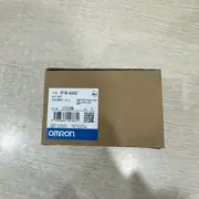 Omron CP1W-AD042 4-channel analog input expansion unit — front view showing the 85 × 90 × 31 mm body with 4 differential analog input channels on the removable M3 screw terminal block