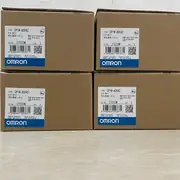 Omron CP1W-AD042 4-channel analog input expansion unit — top label close-up showing the model number CP1W-AD042 and the 4-channel input / no-output designation