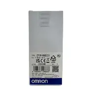 Omron CP1W-MAB221 analog I/O option board — small PCB card sized to fit inside a CP1L-EM CPU option-board slot, top side showing Omron label and the four I/O terminals (V1/I1, V2/I2, V OUT1, V OUT2)