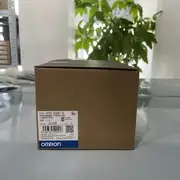 Omron CP2E-S30DT-D — top label close-up showing the part number, the 24 VDC supply marking, the 8K-step program capacity, and the Ethernet port indicator