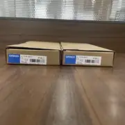 Omron CS1W-CN223 I/O connecting cable — 2 m shielded cable with high-density CS1W I/O bus connectors on both ends, cable jacket printed with the Omron CS1W-CN223 part number and length marking