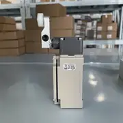 Omron D4B-4111N aluminum safety limit switch — bottom view showing the M20 × 1.5 conduit entry for cable gland, the dust-cap, and the spring-loaded lever return mechanism