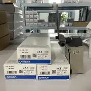 Omron D4B-4116N limit switch — front view of the aluminum die-cast body showing the adjustable roller-lever actuator, the head-direction indicator window, and the M20 conduit entry