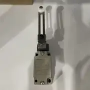 Omron D4B-4116N limit switch — top label close-up showing the part number, the snap-action 1NC/1NO contact symbol, the 250 VAC 10 A rating, and the IP67 enclosure code