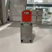 Omron D4BS-25FS hinge-mount safety door switch in its shipping carton with the type label visible