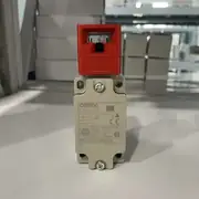 D4BS-25FS switch removed from the box, showing the metal head, M20 conduit entry, and rating label with 10 A / 400 V / IP67