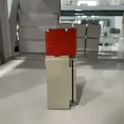 D4BS-25FS top view with the operating-key slot, conduit entry on the side, and the metal hinge-mount body