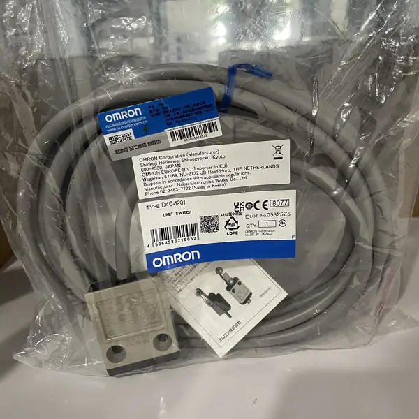 Omron D4C-1201 limit switch — sealed plastic bag with the metallic limit switch body visible (pin plunger on top, two mounting holes on the front), 3 m VCTF cable coiled, instruction sheet, and Omron label TYPE D4C-1201 LIMIT SWITCH, OMRON Corporation, MADE IN JAPAN, QTY 1, LOT No. 05325Z5
