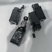 Omron D4NA-4122 — front view of the D4N-series plastic safety limit switch with the pin plunger extended and the operation LED visible