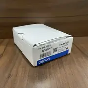 D4NL-1AFG-B guard-lock safety-door switch in its branded Omron shipping box