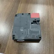 Omron D4NL-4CFG-B — bottom face showing the M20 conduit entry, the solenoid terminal block, and the contact terminal block for the four slow-action poles
