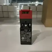 Omron D4NS-1AF safety door interlock switch — side view showing the 4 mounting holes (M4 / M5) on the body and the head rotation indicator showing the 4 possible key insertion angles