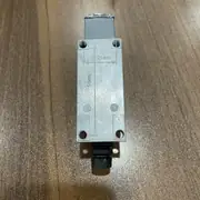 Omron D4V-8108SZ-N vertical limit switch in the shipping carton with the type label visible