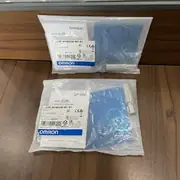 Omron E2B-M18KS08-M1-B1 inductive proximity sensor — top label close-up showing model code and 8mm sensing distance