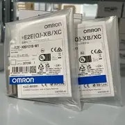 Omron E2E-X8B1D18-M1 — top label close-up showing the part number, the 8 mm sensing distance, the 10-30 VDC rating, and the IP67 protection mark on the housing