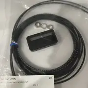 Omron E32-C91N 2M reflective fiber optic cable in the shipping bag with the M3 nut and washer resting beside the head