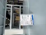 Omron E3FA-DP21 diffuse sensor — sealed plastic bag with Omron specification label showing TYPE E3FA-DP21, Photoelectric Sensor, 10 to 30V DC, Q'TY 1, LOT 11124M, CE and UKCA marks