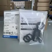 Omron E3FA-TN21 2M — emitter and receiver visible through the packaging, 2 m cable coiled