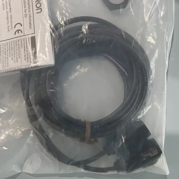 Omron E3FA-TP11 2M through-beam photoelectric sensor pair in the shipping carton with the type label visible