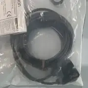 Omron E3FA-TP11 2M through-beam photoelectric sensor pair in the shipping carton with the type label visible