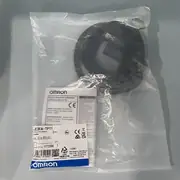 E3FA-TP11 2M box label showing the 15 m range, PNP output, 2 m pre-wired cable, and the ABS M18 body marking